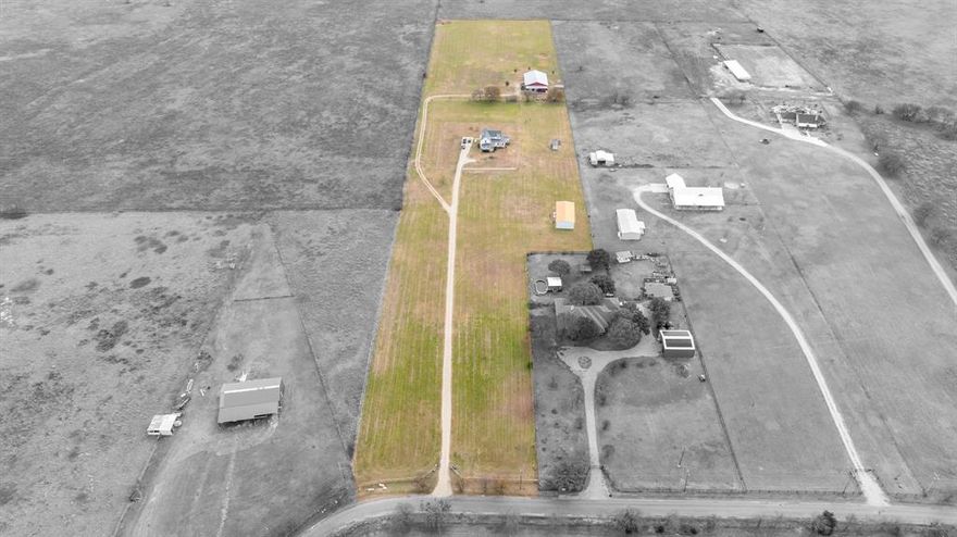 THIS PROPERTY IS A DREAM COME TRUE YA’LL!!!  AND THE PRICE...WHAT THE HECK...$208,524 BELOW TAX APPRAISED VALUE!!! SELLERS SAY C'MON! GIDDY UP BEFORE YOU MISS THIS OPPORTUNITY to LIVE the COUNTRY LIFESTYLE! WIDE OPEN SPACE, SUNSETS, MULTIFAMILY LIVING, WELCOME HOME!! TWO AWESOME WORKSHOPS! NO CITY TAXES & NO HOA! Nestled on 11.168 PICTURESQUE ACRES in the sought-after Waxahachie, offering the perfect blend of luxury, functionality, flexibility and wide-open space. THE PROPERTY IS FULLY EQUIPPED FOR ALL YOUR TOYS AND HOBBIES WITH A MASSIVE WORKSHOP FEATURING ELECTRICITY AND AMPLE RV STORAGE with a SECOND RESIDENCE, perfect for in-laws, adult children, guests, or rental potential. One WORKSHOP has 3500 SQFT with Concrete Floors, a toilet, 3 ROLL UP DOORS, ELECTRICITY, a 1500 SQFT APARTMENT with 2 Bedrooms, 1.5 Bath, Full Kitchen, Living Room, Huge Walk in Closet, Utility Room & Two HUGE COVERED PATIOS to Catch Every Angle of the Stunning Texas Sunsets! FANTASTIC LOCATION close to shopping and IH 35 for a commute, if needed! This stunning WELL MAINTAINED BEAUTIFUL MODERN FARMHOUSE features FRONT & BACK COVERED PORCHES, an OPEN FLOOR PLAN ideal for entertaining, Gleaming Stained Concrete Floors & Wood Floors Throughout for Easy Maintenance, DECORATIVE LIGHTING THROUGHOUT, ISLAND KITCHEN with tons of Cabinets & Countertops, OVERSIZED MUDROOM, Gorgeous PRIVATE Primary Bedroom Downstairs with a Shabby Chic Primary Bath with a Separate Shower & Charming Claw Foot Tub. All other Secondary Bedrooms are located Upstairs and have their own BATHS! OVERSIZED UTILITY ROOM offers abundant storage, built-ins, and a sink for added convenience. PEACEFUL COUNTRY LIVING WITH MODERN COMFORTS, SPACE TO SPREAD OUT, AND ENDLESS POSSIBILITIES, THIS ONE TRULY HAS ALL THE BELLS AND WHISTLES. Bring the ANIMALS!! Schedule a Showing Today & Submit your Offer!