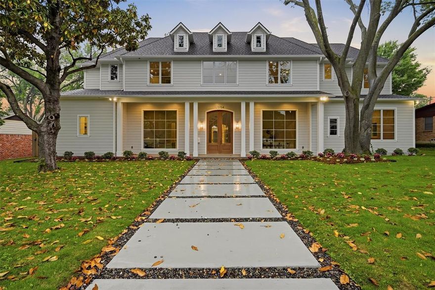 This custom Preston Hollow home blends classic Southern charm with modern farmhouse style, featuring a symmetrical façade, gabled rooflines, dormer windows, and a welcoming covered front porch framed by mature trees and a structured walkway. Inside, a bright open layout offers high ceilings, abundant natural light, and seamless flow for everyday living and entertaining. The chef’s kitchen includes professional-grade appliances, double islands, and ample storage, complemented by a butler’s pantry, wet bar, and walk in wine room. Spacious bedrooms and flexible living areas include a dedicated study, study nook for 3, and expansive upstairs retreat. The backyard is a private outdoor oasis with modern hardscaping, a pool with recessed fire-pit lounge, outdoor kitchen, and covered patio for effortless indoor-outdoor living.