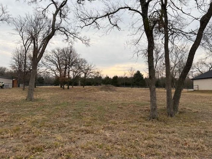 Beautiful wooded building site on 1 plus acres, in Frank Wood Road Addition.  The water Tap in and the meter is paid for, and a Culvert has been installed. Building restrictions but No HOA.   Near Lake Texoma and Hwy 82.