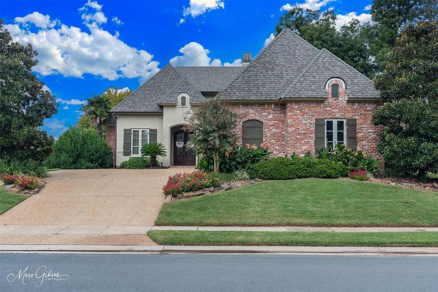 Step into sophistication with this exquisite Ryan Smith custom-built residence, perfectly situated in the premier neighborhood with captivation Red River  views.  Designed for those who appreciate both luxury and livability, this home welcomes you with soaring ceilings, expansive windows that fills every room with natural light. Finely crafted details-like rich hardwood floors, custom millwork, and designer crown molding-create an atmosphere of timeless elegance.  The gourmet kitchen, featuring top-tier finishes and abundant storage with a walk in panty. Opening up to a warm inviting living area ideal for entertaining or quiet evenings at home.  Retreat to the spacious primary suite, a true haven of relaxation complete with a spa-inspired bath and a walk-in closet and french doors that lead to the back yard. Two other bedrooms with one being office ready with built-ins and a closet Murphy bed if needed.  Outside, beautiful copper gutters adore the home. Enjoy peaceful surroundings and beautifully manicured landscaping with an in-ground sprinkler system that perfectly complement the home's refined character.  Every element of this property have been carefully curated to provide comfort, function,  and effortless elegance-a sanctuary you'll be proud to call home.