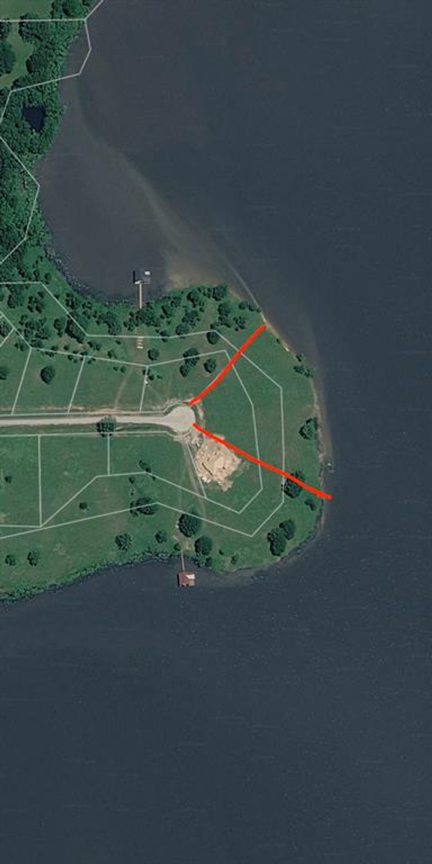 Exceptional opportunity to own one of the prime waterfront lots on Lake Fork! This approximately 2.4-acre open-water tract offers over 540 feet of pristine shoreline, providing expansive lake views and unparalleled beauty. Widely regarded as the best lot in the neighborhood, this property combines generous frontage with a premier location inside a gated community featuring a private boat ramp.
Approximately ¾ acre is buildable, with an additional 1.5+ acres in leaseback, giving you the feel of a much larger estate while maintaining manageable ownership. Build your dream lake home with a minimum 1,200 sq ft floor plan—site-built homes only (no barndominiums or mobile homes), ensuring long-term quality and value throughout the community. Seriously; listen Linda. Over 500’ of open water shoreline in a private community is HARD to find!

Whether you’re envisioning a full-time residence or a luxury lake retreat, this is a rare chance to secure an elite Lake Fork homesite. PRICED TO SELL—don’t miss this one-of-a-kind waterfront offering.