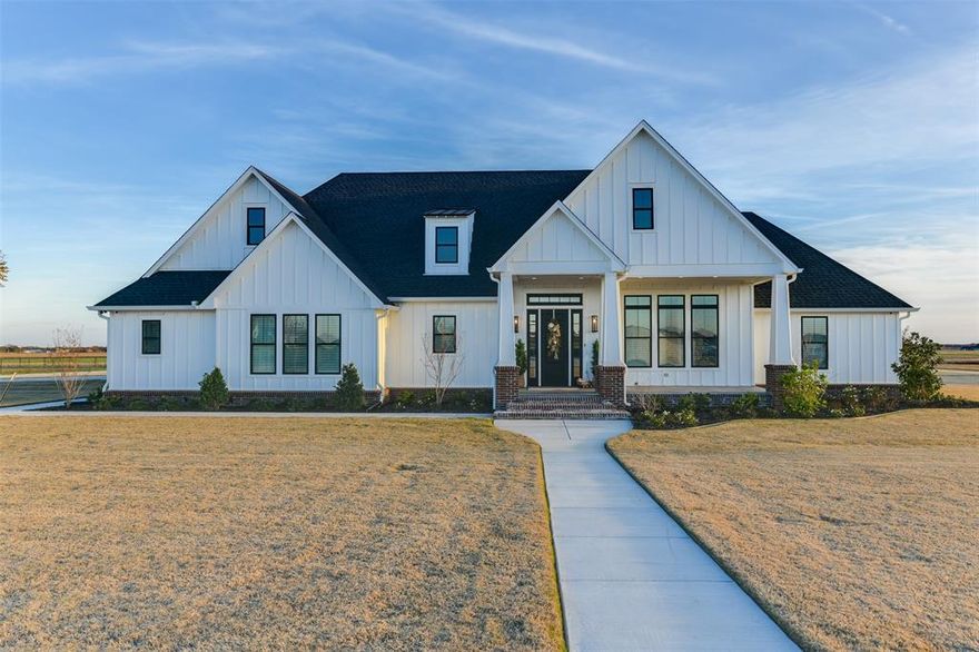 NOTICE!! MAJOR PRICE IMPROVEMENT!!!!!  
True custom home. Occupied only 4 months. Beautiful home with too many Amenities to list here. Check transaction desk for amenities. 12.951 acres
of country living with all the modern conveniences.  Hand scrapped flooring, heated floors in the master bath, built in subzero commercial fridge, 3 ovens, commercial vent a hood in kitchen and patio for outdoor kitchen and built in grill. Remote controlled curtains open to a beautiful pool area. Huge 5000 sf shop that has a full bath with laundry hookups and climate controlled. Shop has 4 remote controlled doors, humidifier, three 50 amp hookups both 110 v and 220v outlets with a separate security system. This would be the perfect place for a small business. Approximately 2 acres have been landscaped to include sod, planting 32 trees and flower beds. The pool has LED lighting, robotic pool sweep and a fire pit. Entry of Austin stone with hand built electric gate. Propane is only used to heat the pool, Cookstove, fireplace and run the backup generator. House and shop have electric heat.