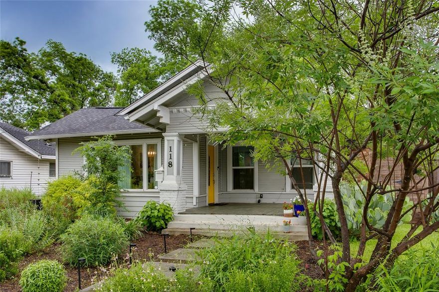 There’s a quiet charm to this Sunset Hill Craftsman, one that reveals itself gradually, from the welcoming front porch to the unexpectedly spacious backyard beyond. Set behind a horizontal-slat privacy fence and framed by mature trees, the home offers a sense of calm just minutes from Bishop Arts, Sylvan Thirty, and downtown Dallas.

The interior is light-filled and intuitive, with an open-concept living and dining area designed for connection. A large picture window draws in the outdoors, giving the dining space a natural focal point, while the living area flows comfortably alongside. The kitchen has been thoughtfully updated with quartz countertops, stainless steel appliances, and refreshed cabinetry, blending functionality with a clean, modern aesthetic.

The primary suite is tucked away with its own ensuite bath and walk-in closet, creating a private, comfortable retreat. Two additional bedrooms sit along the back of the home, each with views of the lush yard.

It is here where the home truly expands. The backyard is both generous and usable, with a lush green lawn, mature trees, and a patio strung with café lights that set the stage for gatherings, quiet mornings, and everything in between. A storage shed offers added versatility, while the gated driveway enhances both privacy and function.

Equally important are the behind-the-scenes improvements, including repaired foundation work, fresh attic insulation, and recent system updates such as HVAC, tankless water heater, roof, and double-pane windows, adding a layer of confidence to the home’s character.

A home that lives simply, beautifully, and with just the right amount of intention.