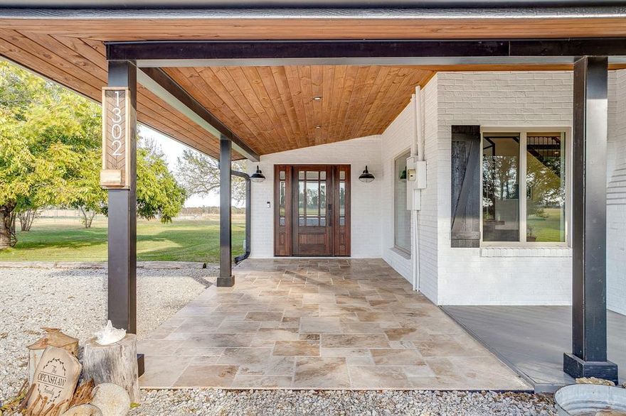 Looking for Character, Charm & History without losing modern day luxury, efficiency & layout: you've found it here in Peaster ISD! This solid 1947 build has been lovingly remodeled to current code & efficiency that affords you incredibly low electricity monthly bills. Without losing the square footage & privacy for your family. Downstairs offers 2 Living areas, wood burning fireplace for those cold weather days, oversized Dining Room space & huge open layout kitchen with vaulted ceilings for added wow factor when entertaining. 3 downstairs bedrooms offer easy accessibility - both guest bedrooms downstairs are 16FT by 16FT. Primary suite downstairs offers a huge ensuite full bathroom with walk in shower & separate soaker tub (full size!) with double vanities & closets. Upstairs is a self contained living space, perfect for family members looking for space or longer staying guests! Full bathroom, large bedroom with its own walkout balcony & double closets, large living area with kitchen. Entertaining space is large enough for any party your heart desires with the covered back patio overlooking the spacious shaded yard. Want a change of scenery, relax on the full length covered front porch overlooking the 2nd well on the property at the authentic Windmill. Front Orchard offers peach & cherry trees as well as large producing Pecan trees scattered throughout. Three RV hookups on the property, 1x 30amp, 2 x 50amp (separate locations). 2 level areas for Arena install. Great area to install a Pool by the back deck. Easily cross fence for rotational horse turnout pastures. 2000sqft shop (45x45) with power can cater to all your hobby desires, especially with its fully enclosed workshop room, that can also serve as a storm shelter space. Second barn (20x40 800sqft)- currently used as a run in shelter for livestock & horses has a concrete base & power. Ask for the Updates & Utilities List! Property can sell as 5.5, 10 or 22 acres - ask for info. Appraisal in hand.