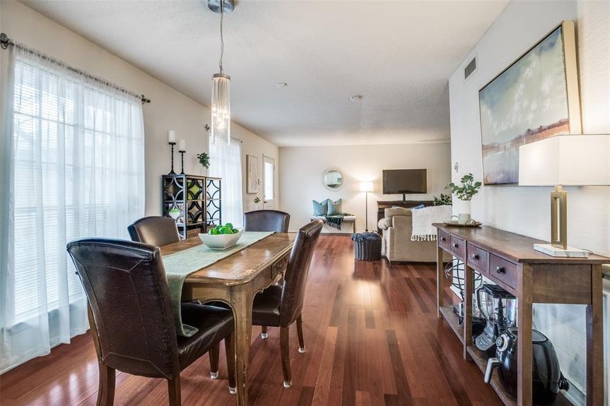 Move-In Ready! Well-maintained garden-style condo in the hidden gem of La Fontaine. Inside the gates, underneath a canopy of trees, you'll find a quiet, peaceful setting with landscaped gardens and fountains. 2nd floor corner unit with an open, spacious floorplan. Rich hardwood flooring in living and dining, with plush, upgraded carpet in bedrooms, newly replaced Feb 2026. Both Bedrooms have attached full baths. Spacious closets and good storage space throughout! Kitchen has a french-inspired color palette, white cabinets, SS appliances and good-sized pantry! Washer and Dryer in Unit. Fridge, Washer and Dryer stay with condo! Assigned Covered Parking Spot is close to Entry Gate, Reserved Spot #65. Generous amount of guest parking available. Private Community Pool is one building over between 6017 and 6015. Lock and Leave Lifestyle in the heart of Dallas, walking distance to Central Market, Ridgewood Trail. Convenient access to Greenville Ave, SMU, Northpark.