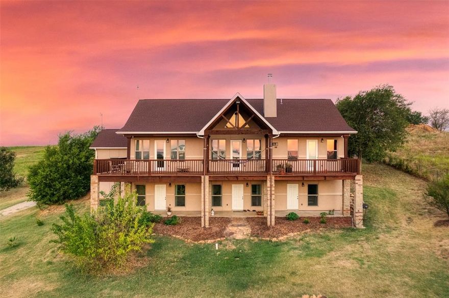 Take in breathtaking 180-degree views of Lake Ray Roberts with this exceptional 1.9 ac property offering over 3,800 square feet of living space, seamlessly integrating indoor & outdoor living to take full advantage of the stunning views. Inside discover elegant wood floors, a grand kitchen featuring custom cabinets & granite countertops. An open floor plan with a living area featuring expansive windows framing captivating views of Lake Ray Roberts. The expansive balcony is ideal for entertaining and picturesque views. The primary suite showcases an ensuite bath, a multilevel closet, walk-in shower, & dual vanities with granite counters. The lower level, has two additional ensuite bedrooms with private baths, kitchenette, a craft room, offering a versatile living space. The Estate also features a 1,400-square-foot guest house, a 500-square-foot garage apartment, and six covered garage spaces. A meandering path leads from your fenced yard directly to the shores of Lake Ray Roberts.