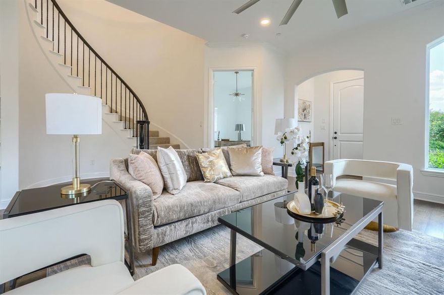 French-inspired Provence Subdivision. This townhome features numerous upgrades, including hardwood floors throughout the entire first floor, a modern gas fireplace, a custom-painted study, and high-end light fixtures — making the first floor ideal for entertaining. A mudroom and half bath are located off the entry from the garage. The kitchen offers upgraded quartz countertops, a decorative backsplash, Bosch stainless steel appliances, and a large walk-in pantry. The first floor also includes a private study at the entry, overlooking the waterfall. Upstairs, you’ll find an open game room or second living area with abundant natural light and a private terrace. The primary suite includes dual sinks, a large frameless glass shower, a standalone tub, and separate his-and-hers closets. Creek lot.