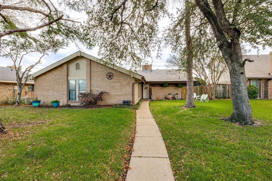 Charming three-bedroom, two-bath home nestled in an established neighborhood on the outskirts of Garland, offering convenient access to major commuter routes including I-635 and I-30. Surrounded by mature trees, this property provides both comfort and opportunity, making it an ideal choice for buyers looking to create a space that truly reflects their personal vision.
Inside, you’ll find a spacious living area perfect for gathering and everyday living, along with an eat-in kitchen ready for your updates and design ideas. A private hallway leads to the primary bedroom, creating a functional and well-thought-out layout.
Step outside to a generously sized backyard with plenty of room for entertaining, weekend barbecues, or space for pets to play. A storage shed offers additional flexibility for tools, hobbies, or seasonal items. The garage also provides ample storage solutions to keep everything organized.
Major system updates include a roof approximately three years old, as well as a water heater and HVAC system that are both roughly one year old, offering peace of mind for future homeowners.