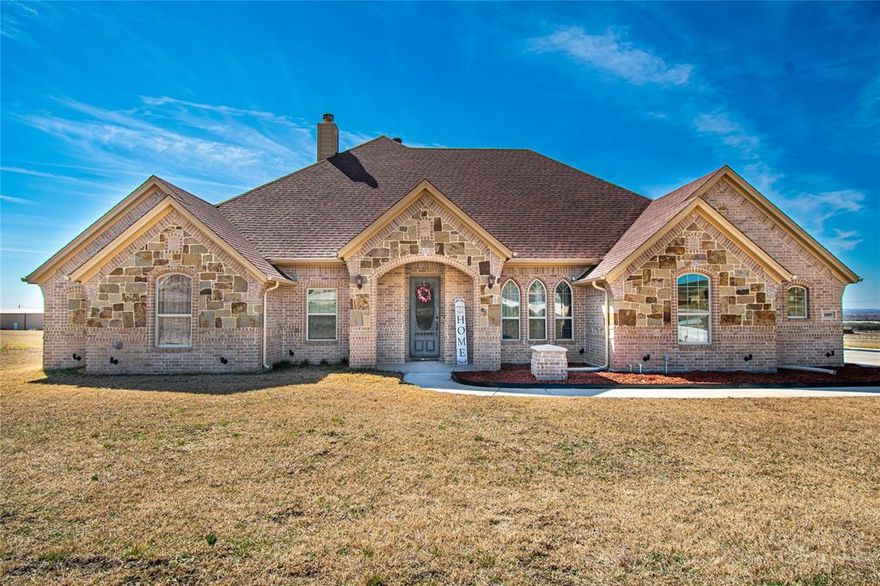 Exquisite 4 bed 2.5 bath custom dream home on over 2 acres in desirable Sky View Ranch Estates. Nestled on a quite cul-de-sac, this property offers a flexible and functional layout designed for modern living. The home features a formal dining room, light filled living area with fire place, and a well-appointed kitchen with generous counter space, knotty wood cabinets, and granite countertops. A versatile flex room provides perfect space for a home office, playroom, workout room, or additional living area. Huge primary bedroom with bathroom suite attached that boasts his and her sinks, walk-in shower, garden tub, and walk-in closet that is connected to the laundry room. Oversized guest rooms with walk-in closets. Home has tile floors throughout living areas, kitchen, and bathrooms, with plush carpet in bedrooms. Home also has a 3 car garage with water filtration system and a 240 volt plug if needed. Entertain guest with spacious covered back porch and fireplace. Any animals welcomed, with secure top rail fencing, or enjoy your gigantic backyard with more than enough room for playtime. Save money with no City Tax! Water provided through well, no water bill! You will not be disappointed with the sunset views in the evenings! Home is move-in ready! Schedule your showing now, won't last on the market!