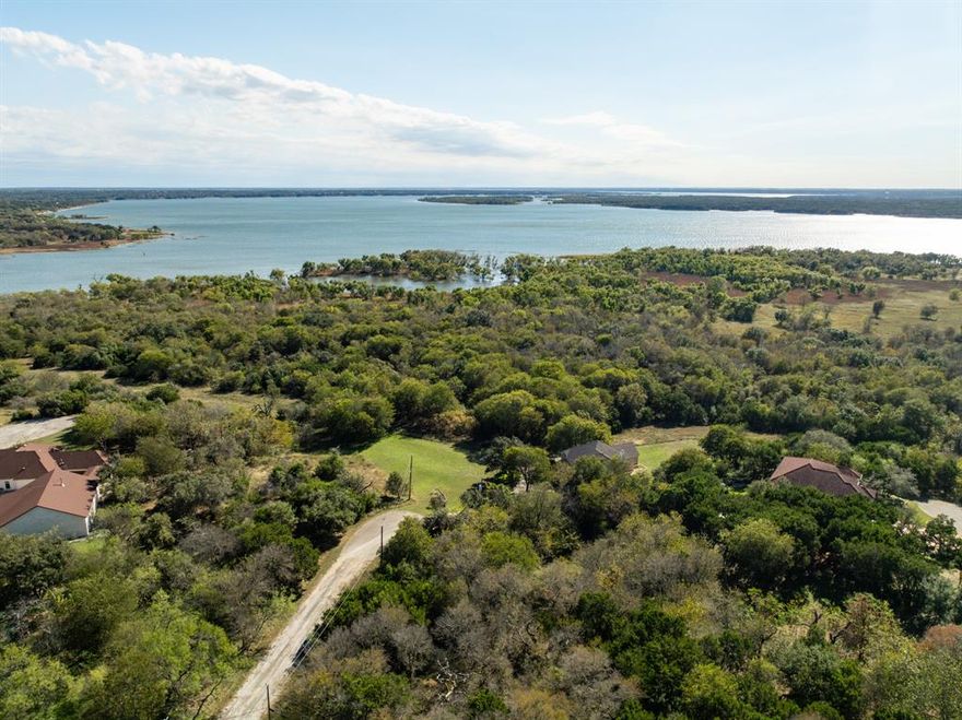 Build your dream home or weekend getaway atop this 0.31 acre lot near OPEN WATER in White Bluff Resort! Secured 24-7 gated community with 2 world class golf courses to live an active lifestyle while enjoying picturesque views for unparalleled tranquility. Lot is located in the highly desired area near the water front bluffs with marina, jogging trails, pub, and cascade pool! Buy and hold the lot for amenities and golf rounds that are included or get your build started. A small portion of the back corner lies within the 100-year floodplain. Call your agent for a tour of the resort!
