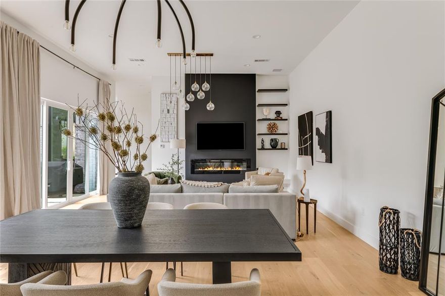 Contemporary Elegance in Glenridge Estates. Welcome to this light-filled, west-facing custom-built 2022 home in the sought-after Glenridge Estates neighborhood of Midway Hollow—move-in ready and designed for modern living, with three bedroom suites and a downstairs office. The open-concept main floor features 12' ceilings throughout, a seamless flow between the living, dining, and kitchen areas, highlighted by expansive sliding doors that open to a private patio and lush green yard—perfect for entertaining or quiet relaxation. A striking stone wall anchors the living room, showcasing a sleek gas fireplace and built-in TV niche. The designer kitchen is both beautiful and functional, boasting beautiful cabinetry, stunning Brazilian marble countertops, built-in refrigerator, double ovens, and a clean, minimalist aesthetic. The kitchen also features a large pantry plus walk in butler's pantry with ice maker, microwave, extra storage and catering space. A private study at the front of the home offers the ideal space for a home office, along with a stylish powder room, mud room, and additional storage or exercise. Upstairs, you'll find three spacious bedroom suites. The primary suite is a serene retreat, complete with a vaulted ceiling, sitting area, spa-like bath with dual vanities, separate soaking tub and shower, and an oversized walk-in closet that conveniently connects to the laundry room. The two guest suites each feature private baths and generous closet space. A vaulted game room completes the upper level—ideal as a media lounge, playroom, or flexible living area. Situated on a quiet loop created by Lively Lane and Beechwood Lane, this home offers a rare sense of tranquility and privacy with no cut-through traffic—your peaceful haven in the heart of the city.