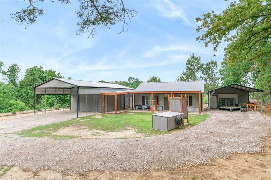 Charming, move-in ready remodeled cottage on a half-acre with dream shop and tons of extras in desirable Cross Roads ISD. No deed restrictions, and no water bill thanks to well water and a water softener. This very well-maintained home features an open floor plan with nine-foot ceilings, Country French kitchen, and a breezeway with rustic knotty pine ceiling connecting the house to an incredible 720-square-foot shop. The stylish kitchen offers elevated counters, granite breakfast bar, European style cabinets with three lazy Susans to make the best use of space, stainless steel range, microwave, dishwasher, shiplap accents, and a trendy tile backsplash that runs to the ceiling. The primary bedroom has access to the 1 bath with updated tiled shower, and laundry space. The 730 SF shop is a true man’s dream, with tongue-and-groove cedar knotty wood walls, 220-volt power, LED lighting, and plugs all the way around. The pavilion shaped cover on the front of the shop is tall enough for equipment, tall trucks or cars. Home has a metal roof, gutters, French drains, outdoor lighting, and a lifetime composite deck for easy outdoor living and enjoying the lovely view. An extra carport with storage provide abundant covered parking and storage, plus an outdoor shower adds a fun, practical touch. The front of the home has a large front porch for sitting and enjoying the outdoors. Recently updated 2025 exterior paint. This well-maintained home is move in ready and in the desirable Crossroads School District.