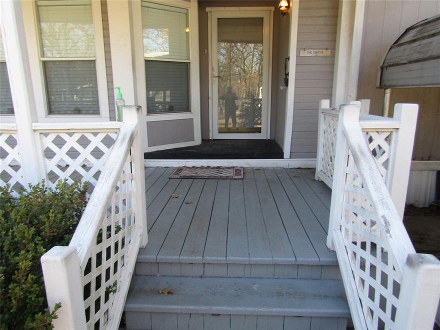 Three Bedrooms, two bath with open floor plan, spacious rooms and closets.  Bedrooms are split and two dining areas are available. Note the enclosed area that you can enter via the back door.   Property is  four lots for a total of 18,687 sqft (.429 acre). It includes a double carport and a large storage building and numerous mature oak trees.  Total property is enclosed with chain link fence.  Home is located a short distance from the lake and is in close proximity to the conveniences of Gun Barrel City.