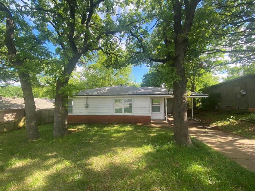 Charming two bedroom, one bath home in Denison, TX! Property is in quiet location on an oversized lot with a fenced backyard. Close to shopping and schools!