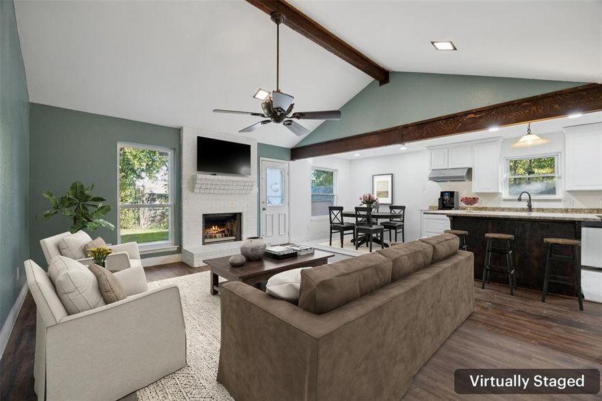 Discover this beautifully updated all-brick, one-story Fort Worth gem set on a large lot and fully renovated for modern living. This 4-bedroom, 2-bath home welcomes you with an inviting living room featuring a soaring vaulted, beamed ceiling and a cozy fireplace that serves as the warm centerpiece of the home. The enviable eat-in kitchen is designed to impress with a large island offering seating, abundant storage, and a bright breakfast nook that fills the space with natural light—an ideal spot for casual meals and morning coffee. Retreat to the serene primary bedroom complete with a stylish ensuite bath. Three additional spacious bedrooms and a well-appointed secondary bath provide comfort and flexibility for guests, work, or hobbies. The large private backyard offers a generous patio perfect for outdoor entertaining, relaxing evenings, or weekend gatherings. Located in a sought-after area with easy access to parks, shopping, and dining, this thoughtfully renovated home blends comfort, convenience, and modern style—ready for you to move right in and enjoy. 3D tour available online. **New Compressor for HVAC to be installed by closing**