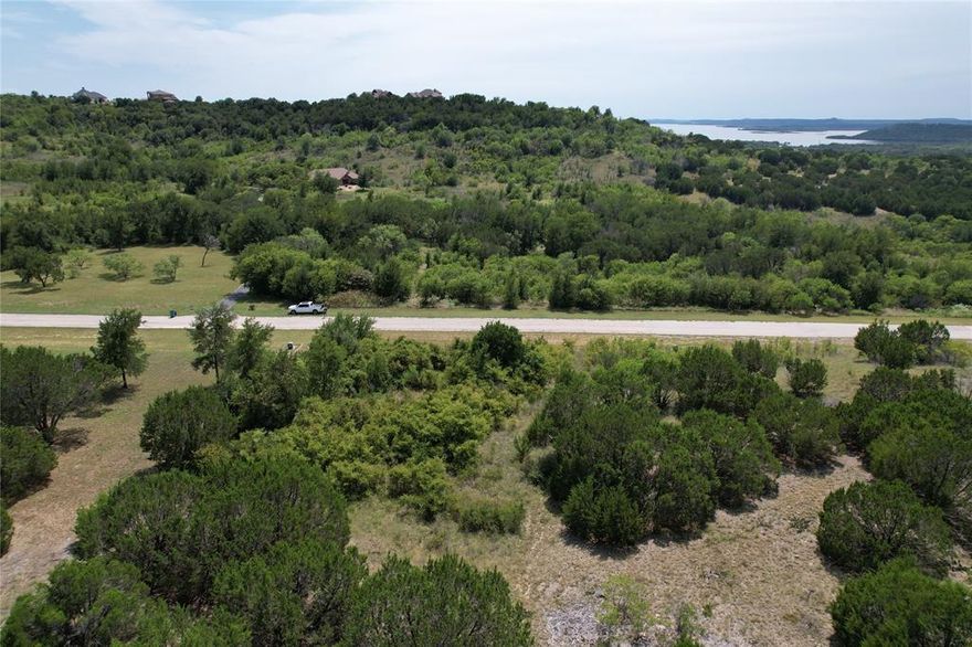 This two acre lot in the scenic and peaceful Hills Above Possum KIngdom is ready to build on. Enjoy nature and serenity and enjoy all the amenities of this neighborhood including; boat storage, boat ramp, community dock, clubhouse with pool and fitness center, cabin on the lakefront with picnic area and covered patio, fishing pond and park area, secure gates, and twenty miles of private roads.
