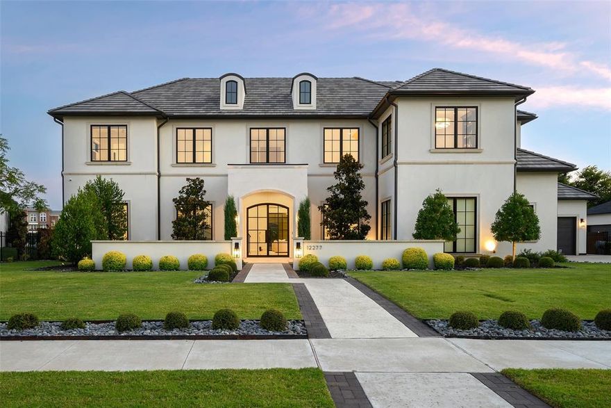 An extraordinary showcase of architectural brilliance, refined elegance, and resort-style living, this estate offers the pinnacle of luxury through masterful craftsmanship, timeless design, and an uncompromising attention to detail. Soaring 15’ ceilings in the family room and 12’ ceilings in main living areas create an open, airy feel, complemented by striking trim and marble inlay details. The grand entry features a 10’ Italian limestone-encased door, leading to a spacious family room with a polished Absolute Black granite fireplace and expansive sliding glass doors for seamless indoor-outdoor living. The chef’s kitchen boasts marble countertops, full-height cabinetry, 60” Wolf dual-fuel range, Sub-Zero fridge and freezer, wine column, dual Asko dishwashers, and a custom vent hood. A sophisticated dining room, custom-built office, and designer-appointed powder bath add style and function. The primary suite offers a serene retreat with a marble-inlay fireplace, steam shower, motorized shades, and private pool and hot tub access. Additional living spaces include a game room and bar featuring a striking dark-stained wood panel ceiling with sleek metal trim, leathered granite countertops, a wine fridge, Scotsman ice maker, and bi-fold windows opening to the balcony. The backyard is an entertainer’s paradise, low-maintenance turf, sports court, outdoor fireplace, front courtyard with fire pit, and a massive L-shaped pool with zero-edge hot tub, deck jets, and bubblers. Whole-home Control4 automation, integrated speakers, upgraded designer lighting, aluminum wood-clad windows, and a whole-home water filtration system enhance comfort and convenience. Extended garages with epoxy floors, landscape lighting, and security cameras complete this exceptional property; offering the ultimate blend of luxury, technology, and resort-style living.