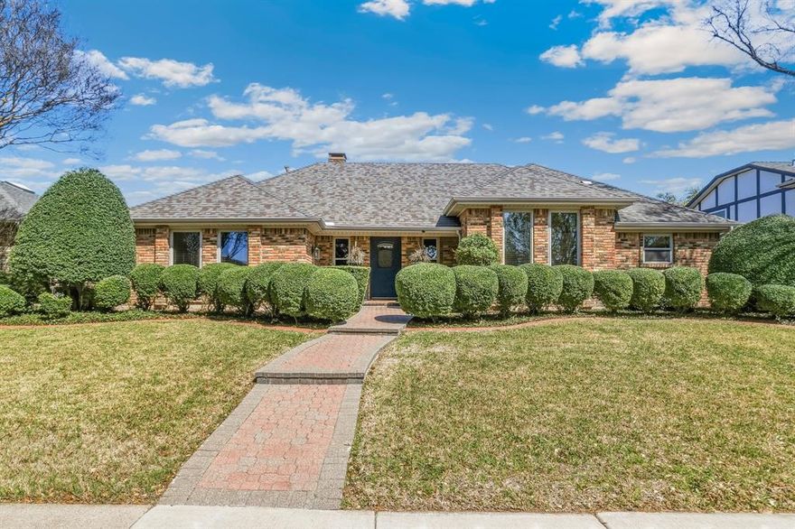 Wow! This one is a must see- Tucked into the desirable Country Forest neighborhood in Lake Highlands, this 3-bedroom, 3-bath home blends warmth, character, and everyday comfort. Inside, you’ll find travertine tile and hardwood floors, vaulted ceilings, beautiful paneling and wainscoting, and eye-catching decorative lighting that adds just the right touch. The living room is cozy and welcoming, centered around a gorgeous brick gas log fireplace—perfect for relaxing with loved ones. Just off the living space, there’s a dry bar already plumbed if you ever want to convert it into a full wet bar. The kitchen is bright and functional with tons of cabinetry, granite countertops, stainless steel appliances, and a cheerful eat-in space filled with natural light. The primary suite is spacious and private, featuring a large garden tub, separate shower, dual vanities, and plenty of storage. All bedrooms come with ceiling fans and walk-in closets, so all bedrooms boast comfort throughout the year. Step outside and you’ll see where this home really shines. The backyard is made for Texas living—with a large inground gunite pool (recently resurfaced and ready for heating), a Trex deck for lounging, and a covered atrium that’s perfect for get-togethers or just cooling off in the shade. You’ll also appreciate the oversized 2-car garage, additional carport, and added peace of mind with a Ring doorbell and cameras. Located in Richardson ISD and zoned to Lake Highlands High School, with quick access to highways, shopping, and great local spots—this one checks all the boxes!!