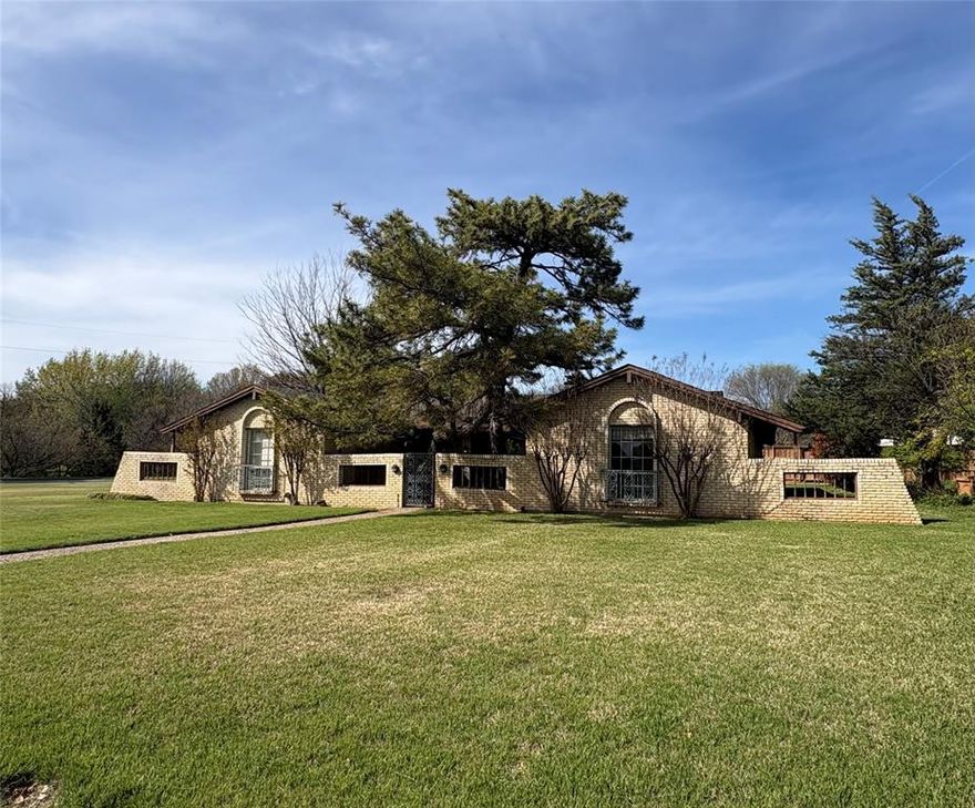 Situated on a large corner lot, this spacious five bedroom, three bath home offers gorgeous views of the tree-lined creek area and Northaven Park. The open, thoughtfully designed floorplan is filled with natural light, creating a warm and inviting atmosphere throughout. With generous living areas and excellent flow, the home provides abundant space for everyday living and entertaining, while offering the perfect opportunity to add your personal updates and style. Terrazzo flooring throughout most of the home.  The grand, stone fireplace serves as a dramatic architectural focal point, anchoring the main living space with character and charm. An oversized garage delivers ample room for vehicles, storage and or a workshop. Surrounded by the area’s top private and public schools. This property combines a premier location, sweeping views, and incredible potential.