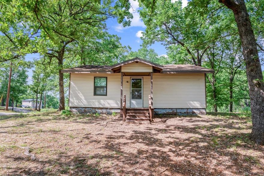 Move in ready or light fixer upper, this cute home is located in the Oak Acres subdivision of Cedar Creek Lake. The property is a very short walk from the wide open water and offers a serene and relaxing surrounding. Sitting on a large corner lot, the house has 3 bedrooms and 2 full bathrooms and lots of living space. The kitchen and living room are an open concept design with a large utility room-bathroom. If you are a weekender or full time, Oak Acres gives you an HOA community that features a boat launch and a very peaceful living environment. Whether you enjoy boating, fishing, walking or just taking it easy, this is the place to be!