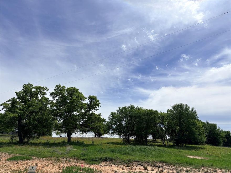 Discover the perfect blend of privacy and freedom with this beautiful acreage property located outside city limits, offering no city taxes and wide open space to create your ideal rural lifestyle. This tree covered tract provides a peaceful, natural setting with plenty of room for a custom home. Designed for flexibility, the property allows livestock including horses, cattle, chickens and goats making it ideal for agricultural use or hobby farming. With ample space for barns, workshops and outdoor living, this land offers the opportunity to enjoy country living while still being within convenient reach of nearby amenities. A rare chance to own useable acreage with trees and stunning space. Builder of choice would have to be approved by developer.