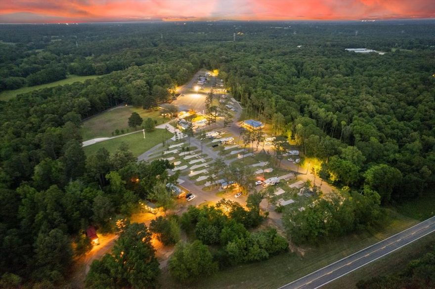 Nestled in the lush landscape of Franklin County, Texas, this remarkable RV Resort and Event Venue presents an unparalleled investment opportunity. Sprawling across a significant parcel of land, the estate features six exquisitely designed cabins, each offering an oasis of tranquility and privacy for guests.
This destination harmoniously blends leisure with functionality, establishing itself as a magnet for both short-term getaways and long-term stays. It houses a plethora of amenities designed to cater to every facet of guest experience. An exercise room with state-of-the-art equipment invites fitness enthusiasts, while a game room buzzes with activity, providing a perfect locale for socialization and relaxation.
The convenience on the premises is unmatched, with a fully serviced laundromat and a quaint general store that stocks essentials, adding layers of comfort to the guest experience. The outdoor offerings are just as impressive. A contemporary dog park and a sparkling swimming pool infuse a lively vibe into the atmosphere, while 65 recreational vehicle hook-ups welcome travelers with open arms. The tranquil fishing pond and an expansive pavilion, equipped with an outdoor kitchen, set the stage for memorable gatherings.
Beyond the confines of this bustling venue, the scenic charm of Lake Cypress Springs lies just moments away, offering an abundance of recreational activities and breathtaking views that promise to enchant.
This commercial venue is not just a property; it's a thriving nexus of hospitality and leisure that caters to a spectrum of desires and needs, positioning itself as a crown jewel in East Texas. For investors seeking a lucrative venture that seamlessly marries profitability with charm, this property is a quintessential choice. For a more detailed overview please reach out to schedule a showing and learn more about this incredible opportunity.