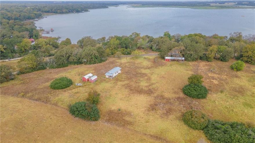Discover the endless possibilities with this beautiful 4.41-acre property on Lake Limestone, offering stunning lake views and lake access in a serene, quiet area. A total of 5 adjoining lots makes up the 4.41 acre property. This land is the perfect canvas to build your dream home or create a peaceful lake retreat. With electricity and water already established, it's ready for development and designed to support your vision. Enjoy the natural beauty and tranquility of lake side living while having the convenience of utilities in place. Embrace the potential of this prime lake view property and make it your own oasis.
