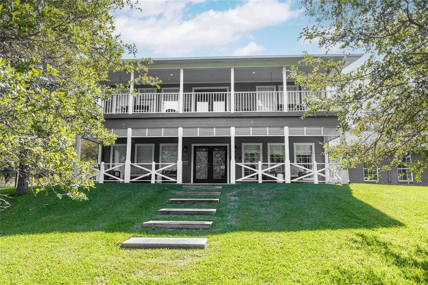 Enjoy captivating panoramic views of beautiful Lake Brownwood from this completely-remodeled, fully-furnished four-bedroom, three-bath lake-front home in Deepwater Estates! Located on a secluded cul-de-sac, the two-story home anchors a heavily-treed 1.55-acre lake-front lot covered in lush St. Augustine grass and fed by a lake-water-supplied sprinkler system. The enormous backyard is fully-shaded and enclosed by decorative see-through steel-framed net fencing. The gently-sloping lot affords hard-to-find lakefront privacy and lots of elbow room between neighbors. And the 52' x 30' two-slip dock is in a class by itself - literally - there are no other docks around it, simply scenic unspoiled lakefront shoreline! The covered outdoor kitchen includes concrete countertops, gas grill, undercounter refrigerator, ice bin and bar seating. The spacious home features an open living-dining-kitchen arrangement with one bedroom and bath downstairs and three bedrooms and two baths upstairs including the primary bedroom. The balcony includes two ceiling-hung porch swings perfect for winding-down a busy day or jump-starting a fun-filled day on the lake. The living room and outdoor furniture are upholstered in Sunbrella fabrics for easy care and clean-ups. And the three-car garage provides ample covered parking with additional parking on the roomy concrete driveway. Deepwater Estates is a gated luxury lakefront subdivision with phone-in gated access from two sides of the subdivision. Subdivision lots range in size from one-and-half to more than four acres. Neighborhood traffic is light and limited to residents and guest only.