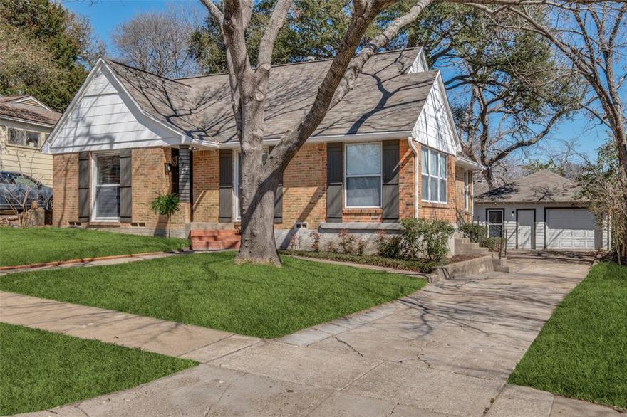 Charming Tudor located in one of Dallas' hottest neighborhoods, Hollywood Heights-Santa Monica, offering a wonderful blend of historic character and opportunity for personalization. The home features original hardwood floors, generously sized bedrooms, and large walk-in closets. 

The kitchen includes granite countertops, stainless steel appliances, and an over-sized eat-in island, creating a great space for everyday living and entertaining. Extra area off of kitchen perfect for dining or a living area. The primary en suite offers a walk-in closet along with an additional closet for extra storage and a stylishly updated bathroom . Updated center hall bath for secondary bedroom. 

A detached garage includes a bonus living area with a bath and kitchenette, offering excellent potential for a guest suite, studio, or home office. The over-sized backyard features a chicken coup, updated fences, and opportunity for expansion.

Ideally located just minutes from White Rock Lake, the Santa Fe Trail, Baylor Scott & White Medical District, and Tenison Park Golf Course. Zoned to highly regarded Lakewood Elementary School. Enjoy convenient access to outdoor recreation, East Dallas dining and shopping, and downtown.

A great opportunity to own a character-filled home in one of East Dallas’ most sought-after neighborhoods.