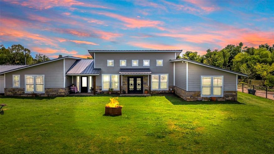 Rare barndo-style modern farmhouse on 10 beautiful acres with private pond access in Wills Point, TX. Located just 50 miles from Dallas, this property offers the perfect balance of peaceful country living and convenient city access. As you enter, you’re greeted by an inviting open-concept layout featuring stained concrete floors, vaulted ceilings, and a striking stone fireplace that creates a warm, comfortable atmosphere. The spacious kitchen, dining, and living areas flow seamlessly together, making this home ideal for everyday living, entertaining, or hosting family and friends. The oversized primary suite provides a relaxing retreat with a freestanding claw-foot soaking tub, large walk-in shower, and a roomy walk-in closet. Two additional bedrooms and well-designed living spaces offer flexibility for guests, a home office, or hobbies. Step outside to the covered porch and enjoy peaceful sunrise views over the pond. The expansive outdoor area is perfect for grilling, gatherings, or unwinding while taking in the natural surroundings. With 10 beautiful acres, there’s room for horses, gardening, ATVs, or creating the homestead you've dreamed of. The property includes an electric entry gate for added privacy, security, and convenience. Whether you're seeking a primary residence, weekend getaway, or a property with room to grow, this modern farmhouse delivers the space, comfort, and tranquility you’ve been searching for. Opportunities like this are hard to find—schedule your showing today before it’s gone.