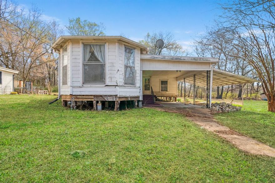 If you’ve been searching for a home with heart, history, and endless potential, this West Paris charmer is ready for its next chapter.  Full of personality and brimming with opportunity, this property offers a flexible layout, beautiful hardwood floors just waiting to be restored to their former glory, ample covered parking, and a spacious lot shaded by mature trees. Bring your creativity and turn this diamond in the rough into something unforgettable.  Situated just south of Clarksville St., it's nearby plenty of shopping options and is just minutes from historic downtown Paris with dining, entertainment, and local culture. Enjoy a location that keeps everything within easy reach. This home is positioned near fitness facilities, grocery shopping, dining, and healthcare services, offering both convenience and comfort in your day-to-day routine.