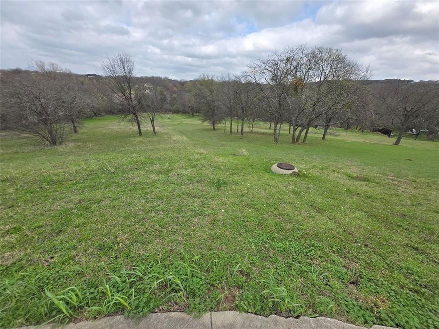 Build your dream home on this beautiful unimproved residential lot located on a quiet cul-de-sac in the desirable Lake Ridge community of Cedar Hill.  This spacious lot offers a peaceful setting with the perfect opportunity to design and build a custom home surrounded by nature and established homes.
Enjoy convenient access to Joe Pool Lake, Cedar Hill State Park, and Tangle Ridge Golf Club, along with the nearby shopping, dining, and major highways for an easy commute to Dallas or Fort Worth.  The lake Ridge area is known for its scenic landscape, rolling hills, and upscale custom homes, making it a highly sought-after location for building.