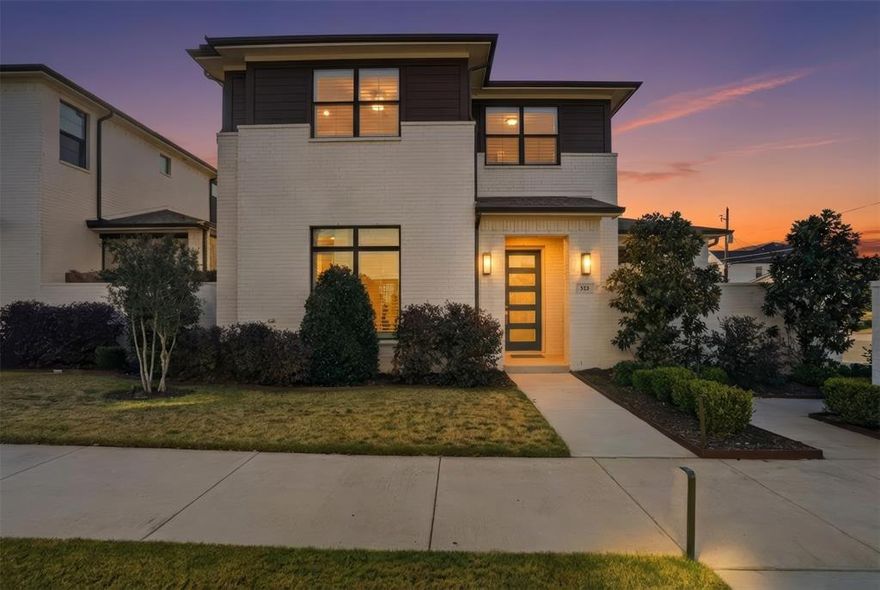 Situated in the sought-after River District, this contemporary home blends thoughtful design with modern comfort. Offering 3 bedrooms and 2.5 baths, the home welcomes you with light-filled living spaces highlighted by engineered hardwood flooring, custom plantation shutters, and a cozy gas fireplace.

The kitchen is ideal for entertaining and everyday living, featuring a generous island, gas cooktop, and a walk-in pantry for ample storage. The primary suite, conveniently located on the main level, showcases custom built-ins, elegant Serena & Lily wallpaper, and a spa-like ensuite complete with a soaking tub.

Outdoor living is equally inviting with a private, landscaped turf yard and a large covered patio—perfect for relaxing or hosting guests. Upstairs, you’ll find a versatile second living area equipped with a built-in entertainment center and desk, making it an excellent space for a home office, media room, or game nights. Two spacious secondary bedrooms, each with walk-in closets, along with a full bath, complete the upper level.

Enjoy close proximity to the Trinity River trails, favorite local eateries including Heim BBQ and Gemelle, and easy access to Fort Worth’s Cultural District.