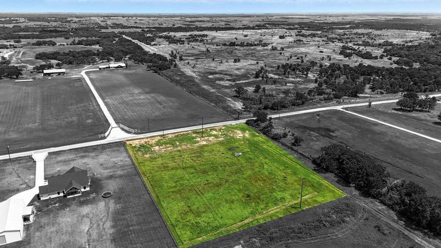 Welcome to Churchill Estates, a brand-new subdivision offering the perfect blend of peaceful country living and convenient access to nearby amenities. Located just 15 minutes from Granbury, this 2+ acre estate lot provides ample space to build your dream home, all while enjoying the serene sounds of the countryside without sacrificing proximity to shopping, dining, and entertainment. Nestled close to Lake Granbury and the charming Granbury Square, Churchill Estates offers the ideal retreat from city traffic with quick access to everything you need. This open, level lot boasts direct road frontage on Colony Road, with planned asphalt roads throughout the subdivision for easy access. Each homesite will require a private water well and septic system. Deed restrictions help protect your investment—available in the documents section or upon request from the listing agent. Photos depict the subdivision and are not lot-specific. Don’t miss your chance to be among the first to call Churchill Estates home!