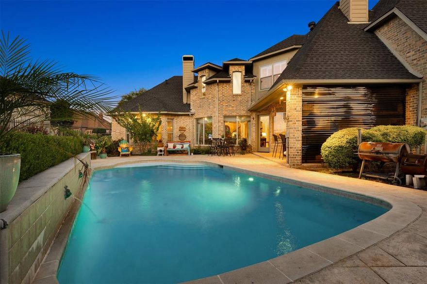 Stunning custom-built home nestled on a large corner lot on the Golf Course in the prestigious Buffalo Creek Country Club Estates. Here is your opportunity to live in this beautiful sought after neighborhood. This home is designed for both comfort and style. From the moment you walk inside, you are greeted by beautiful beams from the foyer to the living area. Inside, the open floor plan boasts a spacious living room and gourmet kitchen perfect for everyday living and entertaining alike. Additional highlights include a formal dining room, a generous home office, and a media and game room for endless enjoyment. The luxurious primary suite overlooks the lush backyard and pool, complete with a spa-like bathroom and a roomy walk-in closet. Three additional bedrooms and 3.5 bathrooms provide ample space for family and guests. Elegant finishes flow throughout, including hand-scraped hardwood floors, travertine accents, and rich wood tones that bring warmth and sophistication. The backyard is truly designed for entertaining, featuring a sparkling pool with water features, covered outdoor sitting area with a wood-burning fireplace and bar, and plenty of space to relax or host gatherings. Buffalo Creek offers an unmatched lifestyle with golf, tennis, community pools, playgrounds, and scenic walking trails. This home is the perfect blend of luxury, comfort, and resort-style living in one of Heath’s most sought-after neighborhoods.  Your standard coffee or golden hour routine is about to get a major upgrade. If you believe every morning or evening deserves a side of outdoor, warm and cozy fire over looking a serene pool with water features, this listing is for you.  It's the upgrade your life has been waiting for!