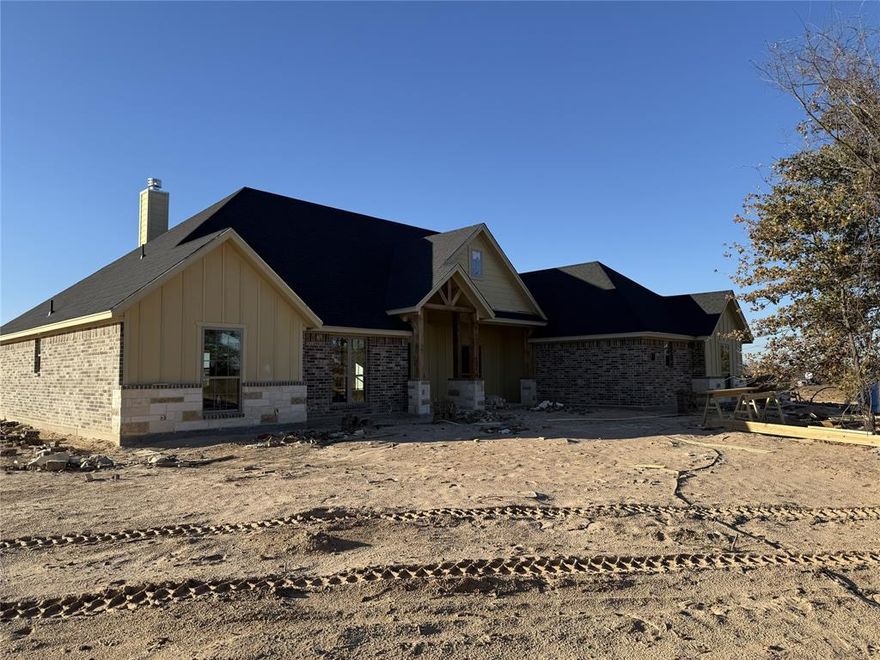 Welcome to your new country retreat in beautiful Parker County!  Sitting on 2 acres, this 3 bd, 2 ba, open floor plan home allows for an easy-living lifestyle. An abundance of windows allows lots of natural light to fill the generously sized living & kitchen areas. A vaulted ceiling in the lvg room, and wonderful wood-like tile floors flow throughout the main areas of the home. Fantastic features of the kitchen include: custom-built cabinets, granite counters, island with seating, divine walk-in pantry, separate cook-top, stainless steel built-in oven and microwave. Greet the morning with coffee, or unwind in the evening, on the covered patio overlooking the spacious backyard. At the end of the day, escape to the private  owner’s ensuite and indulge in a luxurious soak in the tub. The secondary bdrms are nicely laid out and separated from the owner’s suite and, all bedrooms and closets will have carpet. Whether you are working from home or entertaining, you will be ecstatic about calling this place your home.