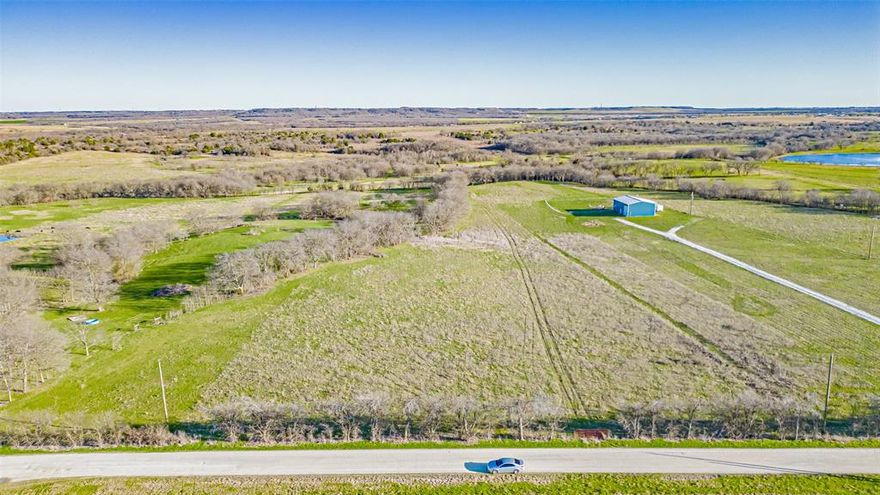Beautiful lot of over 10 acres in the stunning Grand View Ranch subdivision, just 1 minute from I-35 South. This lot features a spacious, cleared area as well as a section with gorgeous mesquite trees, offering the perfect blend of open space and natural beauty.  Utility poles are nearby for easy electricity connection, and water access is also conveniently available.