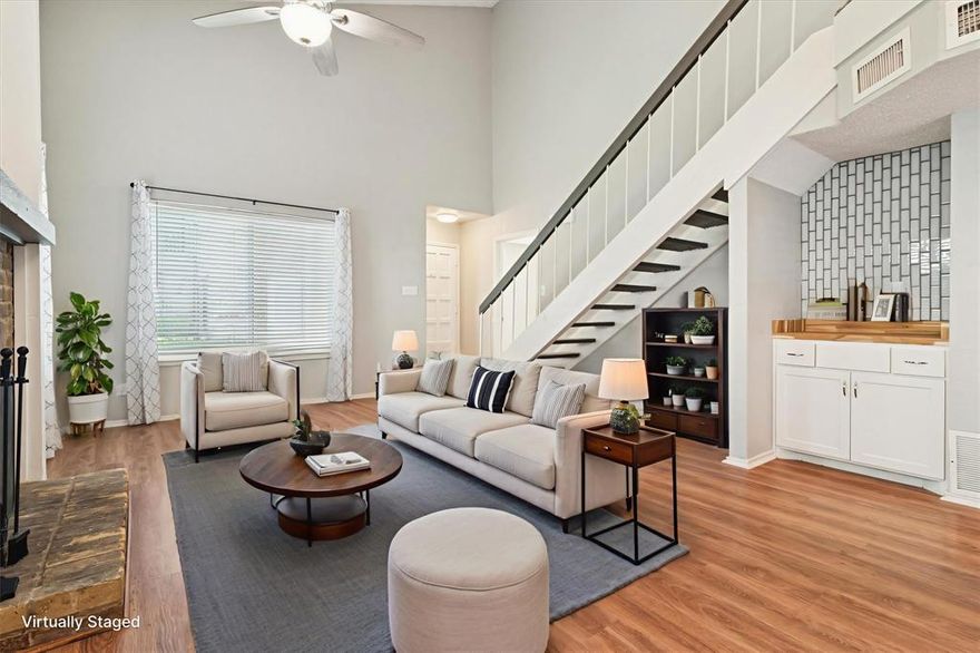 Freshly painted and filled with natural light, this spacious 2 story condo offers the perfect blend of comfort, style, and convenience. New windows throughout create a light and bright atmosphere, enhancing the home’s open layout with vaulted ceilings, luxury vinyl plank flooring on the first floor, and new decorative fixtures and finishes that add a modern touch. Designed for versatility, this home features two split master bedrooms—one on each level—plus a large upstairs study that’s ideal for a home office, workout space, or guest area. The upstairs master suite includes an ensuite bath and a private balcony, perfect for morning coffee or evening relaxation. The kitchen showcases stainless steal appliances, granite countertops and breakfast bar, and a seamless connection to the breakfast room creating an inviting space for everyday living or entertaining. The spacious living room is highlighted by a wood-burning fireplace and a walk-up wet bar. Step outside to the oversized patio, complete with new turf, a French drain, and ample space for grilling and outdoor dining. Recent updates include a new hot water heater (2024), new windows, blinds, furnace, upstairs carpet, and extended vinyl plank flooring (2023), roof (2020), and AC (2019). Beautifully maintained and turn-key ready, this home offers modern updates and functional spaces in a sought-after Richardson ISD location.