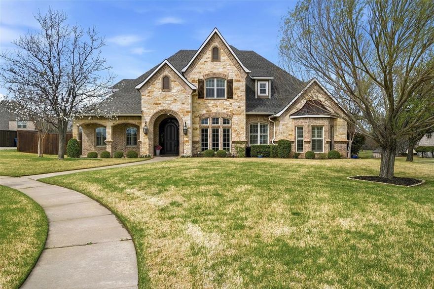 Welcome to 2508 Sedalia Circle, a stunning custom home tucked away on a quiet corner cul-de-sac lot in the highly sought-after O’Hanlon Ranch community in Sherman. Thoughtfully designed with timeless architecture and exceptional craftsmanship, this home offers a true resort-style living experience while remaining just minutes from schools, shopping, downtown Sherman, Highway 75, and Pecan Grove Park within walking distance—all with no HOA. Step inside to find scraped hardwood floors throughout both levels, 8-foot solid wood doors, crown molding, plantation shutters, tall windows, and elegant coffered ceilings. The spacious living room is anchored by a beautiful limestone gas fireplace, built-in cabinetry, and striking brick accent wall, creating a warm and inviting centerpiece that flows seamlessly into the dining area, kitchen, and screened in patio. The chef’s kitchen features custom wood cabinetry with pull-out storage, black marble countertops, a Viking double-door refrigerator, and a large stainless farmhouse sink, making it ideal for both everyday living and entertaining. The primary suite offers a luxurious spa-like retreat with quartz countertops, freestanding composite tub, oversized double rain shower, LED mirrors, makeup vanity, and split his-and-hers closets, including a reinforced safe-room closet. Designed for entertaining, the screened-in sunroom features a gas fireplace, built-in grill, TV, ceiling speakers, and stained concrete flooring. Step outside to your private backyard oasis with a saltwater pool and spa. Additional highlights include a dedicated study with built-ins, noise insulated theater room, upstairs guest suite, oversized Jack-and-Jill bedrooms, side entry 3 car garage, spray foam insulation, two well maintained Carrier HVAC units, and dual tankless water heaters. With beautiful sunsets and views of Sherman’s Lights on the Lake fireworks, this exceptional home blends luxury, comfort, and convenience in one remarkable property.