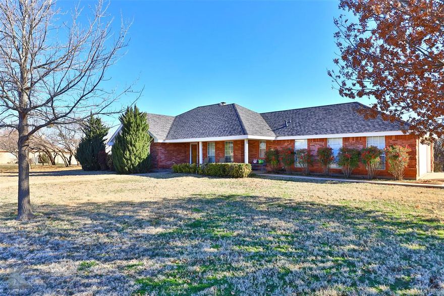 Take a look at this rare gem! This beautiful brick home sits on a 1 acre, corner lot in the quiet, established Colonial Hills subdivision. Excellent location, only minutes from Wylie East Schools. Step into the spacious, open floor plan and high ceilings between the recently painted living, dining and kitchen areas. Enjoy 3 spacious bedrooms, 2 full bathrooms, a flex or office nook off the kitchen, a separate laundry-utility room and oversized garage. Make yourself a hot drink in the kitchen at the coffee bar then enjoy a snuggle in the living room by the cozy wood-burning fireplace. Love the warm Texas weather? The fenced backyard offers shade from the many mesquite trees that add a park-like feel. Lots of great space off the back porch for all your outdoor activities and entertaining. Also plenty of room for a workshop, pool, storage building, etc. Roof was replaced in 2022! No HOA! Schedule your showing today!