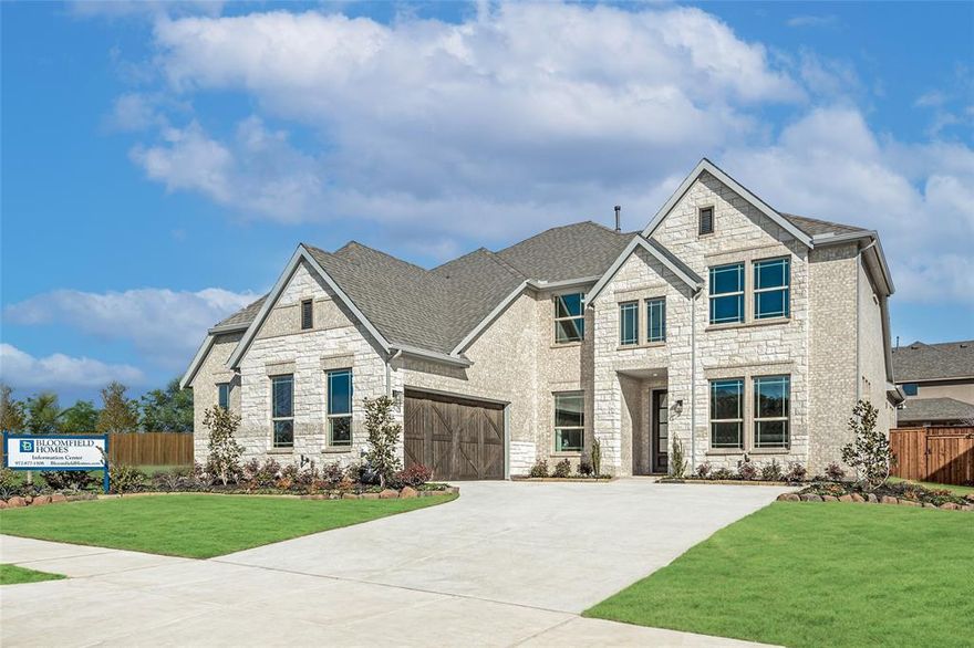 PREMIUM MODEL HOME FOR SALE! Bloomfield Homes is closing out of Windsong Ranch - limited opportunities left including this grand model home in our 'Seaberry' floor plan! Across the street from The Bridge, the 3rd major amenity center with a focus around tree-lined pathways overlooking a peaceful pond - it feels like you have a private park hideaway! The model home comes with custom, designer finishes inside and out. Beautiful, wide wood floors in a light Beachwood color take you from the front formal dining room and study (enclosed by glass French doors) into the expansive family room. A butler's pantry from the formal dining into the kitchen offers another route, with painted white Shaker cabinets, quartz countertops, and Perfit Mosaic backsplash lining the way. Included with the sale of the home are all the built-in stainless steel appliances (practically brand new!), a side-by-side fridge with freezer drawer, and all the custom window treatments and seat cushions made to compliment each space perfectly! 2 bedrooms are downstairs, the Primary Suite and a guest bedroom, and 3 bedrooms are upstairs. Each has a bath directly connected or close by; there's even a Jack and Jill arrangement upstairs! Custom accent walls and paint colors throughout give this home an extra layer of finish, and extra value comes from practical upgrades like upper cabinets in the laundry room, full railing along upstairs half walls, an enlarged primary shower in lieu of a tub, a marble-look tile fireplace with gas logs, full gutters, extra can lighting, and a security system. Landscaping has been professionally maintained since installation, students zoned to Prosper ISD, resort lifestyle amenities just outside your doorstep and so much more! Come visit Bloomfield at Windsong to explore this amazing opportunity.