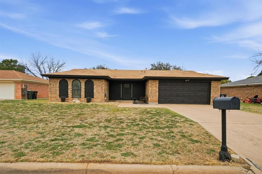 Discover the perfect blend of convenience and style in this inviting 3-bedroom, 2-bathroom home nestled within the heart of Abilene, TX. Offering a generous layout along with a two-car garage, this residence caters to those seeking both functionality and charm. Inside, this home showcases an open floor plan that seamlessly connects the living room, dining area, and kitchen, making it ideal for entertaining and everyday living. The living room draws in natural light, creating an airy, welcoming atmosphere. The well-appointed kitchen is a culinary delight, complete with modern appliances, ample counter space, sleek cabinetry, and an adjacent dining area that is perfect for family meals or hosting friends. The primary bedroom offers a tranquil retreat, with a spacious layout that includes a private en-suite bathroom. Two additional bedrooms provide ample space for guests and a home office space or fourth bedroom, complemented by a well-designed second full bathroom. Both bathrooms boast updated fixtures and finishes, adding a touch of luxury to your daily routine. Stepping outside, the property offers a beautifully landscaped yard, perfect for relaxation or outdoor activities. The patio area is ideal for summer barbecues, morning coffee, or simply unwinding after a busy day, while the spacious backyard offers endless possibilities for gardening enthusiasts or those seeking space to play. This home combines practicality with desirable aesthetics, located close to local schools, parks, and shopping centers, ensuring all your essential needs are just a short drive away. Experience the essence of comfortable living in a community-oriented environment, providing the perfect backdrop for your next chapter. Step into a space that's ready to accommodate your lifestyle and personal touches; your new home in Abilene awaits.
