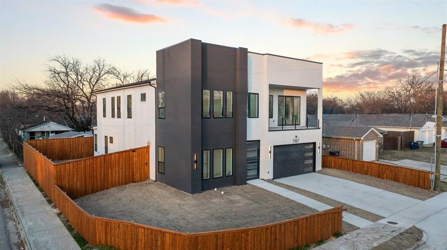 Welcome home to this show-stopping new construction that redefines modern luxury living. This stunning contemporary residence delivers an impressive five bedrooms and three full bathrooms across nearly 4,500 square feet of thoughtfully designed living space. From the moment you arrive, the exceptional curb appeal commands attention. Situated on a desirable corner lot, this architectural gem showcases premium craftsmanship and meticulous attention to detail throughout. Step inside and prepare to be captivated by soaring cathedral ceilings that create an atmosphere of grandeur while flooding the open floor plan with natural light. The heart of this home features two distinct living areas perfect for both entertaining and everyday comfort. The gourmet kitchen is a culinary enthusiast's dream, complete with a pot filler, a generous walk-in pantry, a waterfall island, and abundant custom cabinetry. Sleek finishes and elegant appointments elevate every corner of this remarkable residence. The ground floor primary suite delivers the ultimate retreat, combining luxury with convenience in a space that feels like your personal sanctuary. Upstairs, a spacious second living area-loft opens to a balcony. Other notable features include a tankless water heater & mud area just inside the garage. Location enthusiasts will appreciate the proximity to Trammell Crow Park for weekend adventures, convenient public transit access at the Medical and Market Center station, and easy connections throughout the city via nearby bus routes and highways. This is more than a house. This is an opportunity to own a truly impressive residence that combines contemporary sophistication with functional family living. Schedule your showing today and discover what modern Dallas living looks like at its finest.