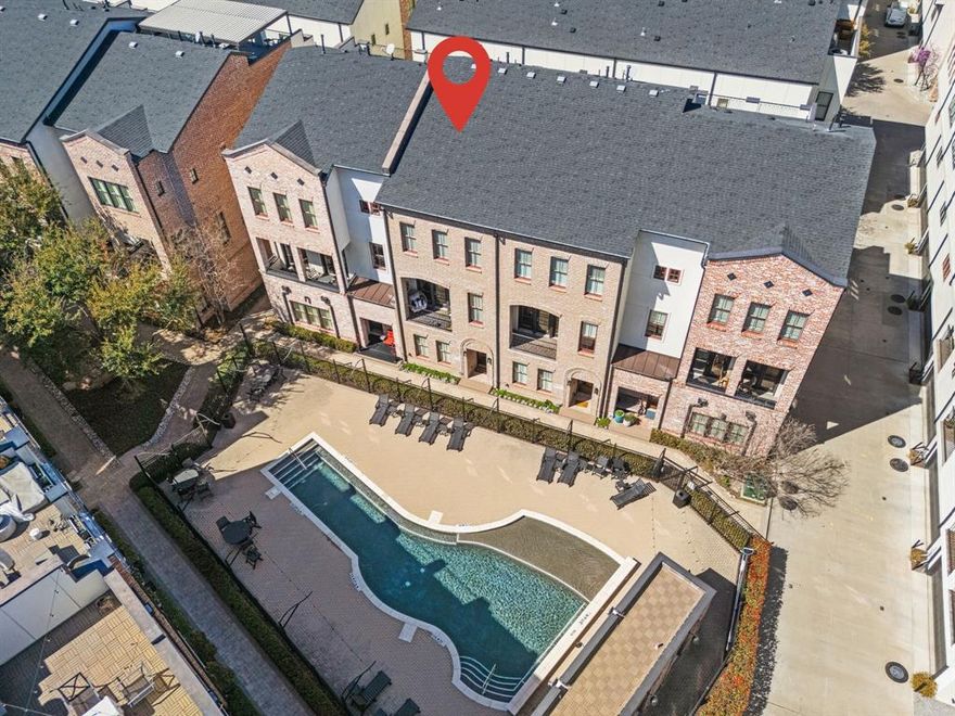 BREATHTAKING VIEWS from your private rooftop terrace in this sophisticated, one owner townhome ideally located in the Farmers Market district of downtown Dallas. This beautifully maintained interior home fronts the community pool, offering serene views from the 2nd level balcony.
Featuring 3 beds, 3 full baths, and 1 half bath, this exquisite home offers a spacious open concept living, kitchen, and dining area designed for both everyday comfort and effortless entertaining. Timeless architecture evokes the charm of a classic New York brownstone-style walk-up, blending sophistication with urban appeal. The community itself includes a sparkling pool and intimate park areas perfect for relaxation. The island kitchen offers abundant cabinetry, granite countertops, walk-in pantry, and gas cooktop. Sunlight streams through tall windows, while soaring 12-foot ceilings elevate the space with light and grandeur. The spacious living room features large, beautiful windows and offers direct access to the balcony. The large primary suite is a private retreat, featuring a spa-inspired bath with a walk-in shower, jetted tub, and walk-in closet. The 1st and 3rd floor guest bedrooms include their own ensuite baths. The spacious 2 car garage with epoxy flooring, storage closet, and built-in shelving provides convenience and protection for your vehicles from the elements. This chic townhome seamlessly blends comfort, elegance, and lifestyle in a truly prime downtown location. Enjoy quick access to major highways for easy travel to DFW International Airport and Love Field, along with premier destinations such as the Bishop Arts District, Uptown Dallas, and Deep Ellum. Exceptional walkability places you steps from the iconic Dallas Farmers Market for fresh local finds, Harwood Park with playground and green space, and Ruibals Plants for vibrant plants and flowers. Don’t miss this chic townhome with undeniable urban appeal, perfectly situated in an unbeatable location!