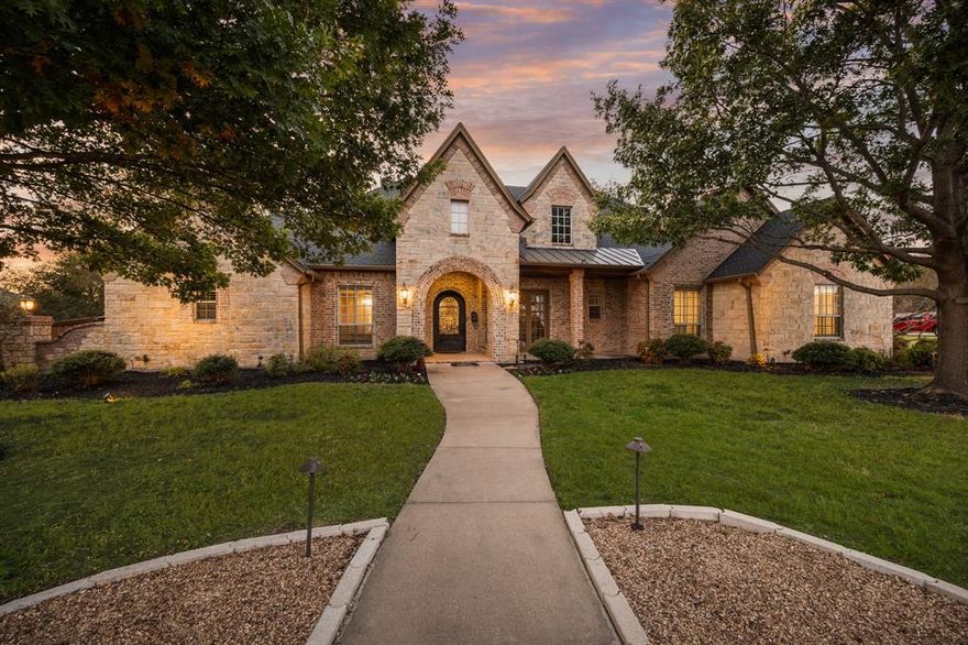 Nearly 5 acres of one-of-a-kind Texas living. This custom-built estate offers luxury with a country flair, delivering the perfect blend of privacy, space, and relaxation. From the front door to the creek’s edge, no detail is spared. Inside, the home features four bedrooms and three-and-a-half bathrooms with a thoughtful, functional floor plan designed for everyday comfort and upscale living. Quality craftsmanship, inviting living spaces, and large windows capture scenic views from every angle. Step outside to your personal retreat. Mature shade trees frame wide-open skies, offering a picturesque backdrop for sunrise coffee or sunset gatherings. The gently sloping lawn leads down to a peaceful, tree-lined waterway with a private dock where fishing, paddling, or simply enjoying the serenity becomes part of your daily routine. 2,400 sq ft shop building, fully spray-foam insulated with a full bathroom. With unmatched outdoor living, luxury accommodations, and top-rated Midlothian ISD. Pool, spa, creek, acreage, privacy, this property has it all. 241 Masters Lane is truly one of one