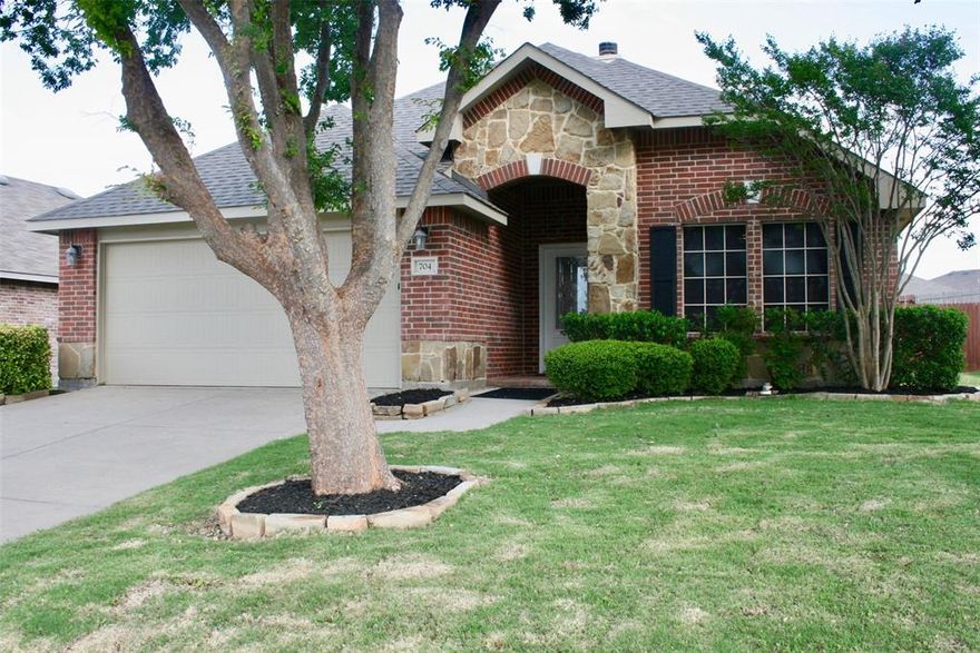 ATTRACTIVE HOME. Located in Spring Meadow Subdivision.  FRESHLY PAINTED INTERIOR.  FULLY BRICKED!  HUGE BENEFIT - NO MUD OR PID FEES, common to other properties is this area. Open floor concept. Spacious eat-in Kitchen with granite counters, plenty of cabinets, a breakfast bar, and pantry. The Kitchen overlooks a 20’x16’ living room with a fireplace. All windows have blinds and solar screens. The Living Room and all Bedrooms have ceiling fans. The Primary Bedroom is a 16’x15’ with a 3’x5’ entry and is perfectly located on the back southeast corner of the home, includes a 12'x5' walk-in closet, ensuite bathroom with dual sinks, separate shower and bath. One Secondary Bedroom is down the hall from the Primary and the other is on the front NW corner allowing for some separation. Laundry Room conveniently located off the kitchen. 2 Car Garage is clean, newly painted, with an epoxy-coated floor.  Covered 8’x6’ brick paver front porch and 10'x8' backyard patio. This home provides comfort with practicality. PLUSES: 1) NEW ARCHITECTURAL TYPE SHINGLES AUGUEST 2025. 2) Radian barrier roof decking with 12''+ attic insulation. 3) Survey available. 4) Conveniently located near schools, downtown Fate. 5) Community amenities include a playground and fishing pond. 6) IT CAN BE YOURS!
