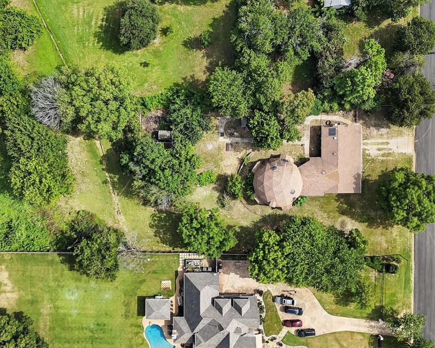 Rare Opportunity in North Bedford – Over an Acre!
Situated on a street with beautiful homes, this unique property offers over an acre bordering the expansive scenic walking trails. Just minutes from DFW Airport, top-rated restaurants, shopping, and parks. The existing spacious dome-style home is filled with character and potential—featuring large rooms, abundant square footage, and a distinctive layout that invites creative renovation. Mature pecan trees, the lot offers a peaceful setting and plenty of space to build a new home if desired. Includes an oversized 2-car garage. Don't miss this chance to own a one-of-a-kind property in a highly sought-after location on over an acre.  part of house has an updated Air conditioning system.