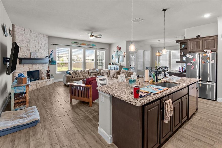 This stunning home in sought-after Godley ISD offers the perfect blend of spacious living, thoughtful design, and modern upgrades. Featuring a wide-open floor plan, this beautiful residence showcases a seamless flow from the oversized living area to the heart of the home — a dream kitchen with rich cabinetry, granite countertops, double ovens, pendant lighting, and an expansive island ideal for entertaining.
The living space is anchored by a floor-to-ceiling stone fireplace and a wall of windows that flood the room with natural light and offer peaceful backyard views. The wood-look tile flooring throughout the main living areas adds warmth and durability.
The spa-inspired primary suite is a true retreat with dual vanities, a luxurious soaking tub, separate walk-in shower, and plenty of storage. Spacious extra bedrooms 
Enjoy relaxing evenings or hosting gatherings on your screened in backporch or in the spacious backyard with privacy fencing and room to roam.
Call today to schedule an appointment to see this wonderful home