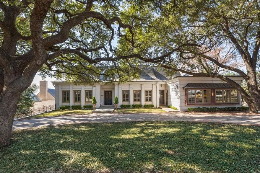 Tucked away on a quiet street in the highly regarded Rivercrest neighborhood, 212 Hazelwood Drive offers a refined blend of privacy, scale, and intentional design. Set on 0.58 acres, the home is positioned to capture elevated views across beautifully maintained surrounding grounds, creating a sense of openness while still feeling secluded and private. A golf cart ride to River Crest Country Club adds to the appeal of the location. Designed with both entertaining and elevated daily living in mind, the home features expansive spaces that flow effortlessly from one to the next. The kitchen serves as a central focal point, offering generous prep areas, substantial seating, and a seamless connection to the surrounding living spaces. Natural light pours in through well-placed windows and doors, framing the outdoor views throughout. The primary suite is positioned on the main level, featuring double doors that open to a private balcony overlooking the grounds. Upstairs, three additional bedrooms are complemented by a spacious playroom, offering flexibility while maintaining a sense of cohesion within the home. A standout feature is the basement level, complete with a full bedroom and bathroom along with a secondary kitchen—ideal for guests, extended stays, or a more private retreat. With direct access from the carport and easy flow to the backyard, this space adds both function and versatility. Outdoors, the pool is thoughtfully positioned for privacy, surrounded by mature landscaping and multiple areas to relax or entertain. From the balcony views to the layered outdoor spaces, the property offers a seamless indoor-outdoor connection that enhances the overall experience. A compelling combination of setting, layout, and location, 212 Hazelwood presents a rare opportunity in one of Fort Worth’s most established neighborhoods.