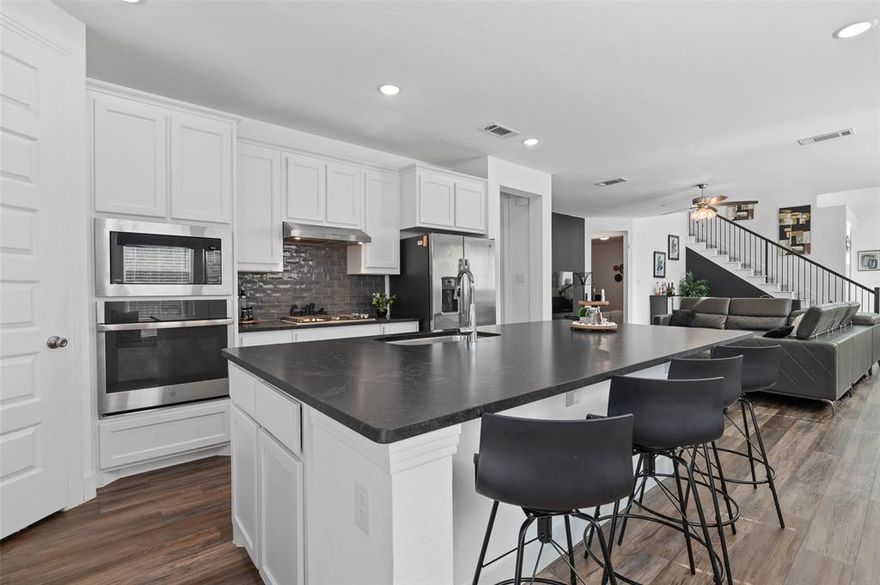 **PRICE ADJUSTMENT** Welcome to this gorgeous Highland Home in the highly sought-after Creekshaw community, where resort style amenities blend seamlessly with everyday comfort. Residents enjoy a sparkling community pool, playground, and scenic walking and jogging trails just steps away.

Inside, the thoughtfully designed layout features a chef-inspired kitchen with a gas cooktop, oversized island, and abundant cabinetry perfect for both entertaining and daily meals. Step out to the covered patio, an ideal spot for outdoor dining or relaxing with friends and family. The first floor also includes a dedicated home office and a spacious primary suite with a luxurious ensuite bath.

Upstairs offers even more flexibility with two additional bedrooms, a generous game room, and a versatile bonus room that can easily function as a fourth bedroom, second office, or hobby room.

Don’t miss your chance to call this exceptional home yours in one of the area’s most desirable communities!